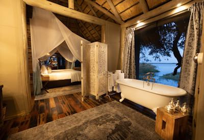 En-suite bathrooms with views of the Okavango Delta