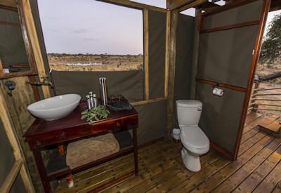 En-suite toilet with bucket shower