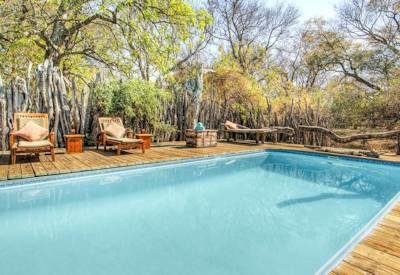Swimming pool and sun loungers