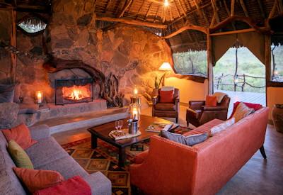Elewana lounge area with fireplace