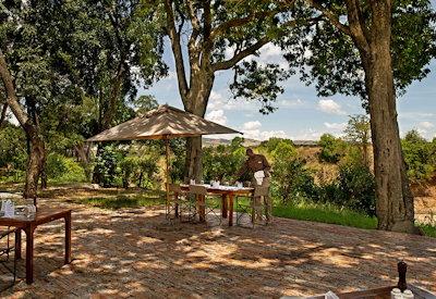 Outdoor dining area overlooking the Sand River