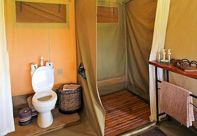 A flushing toilet and indoor shower