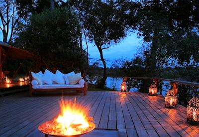 Outdoor deck and firepit at night