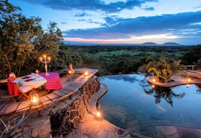 Rim flow swimming pool at sunset