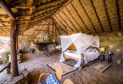 Safari lodge with large thatched suites