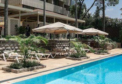 Swimming pool with sun loungers