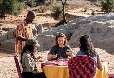 Lunch on the river bank by Sarova