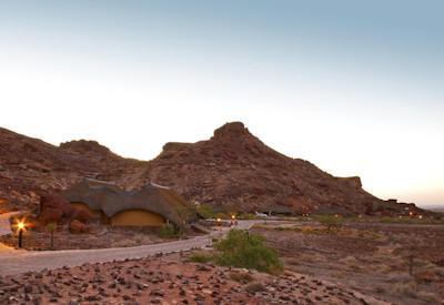 Discover Ai Aiba Lodge surrounded by ancient rock formations
