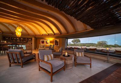 Lounge area views views of waterhole and swimming pools