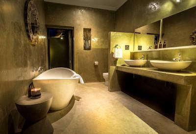 Private bathrooms with bath tubs and showers