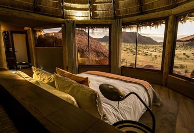 Thatched suites surrounded by rock art