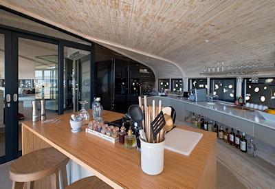 A well stocked bar and fully equipped kitchen