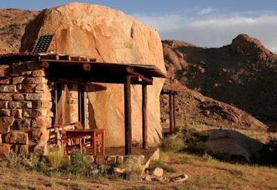 Desert chalets surrounded by rounded granite boulders
