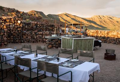 Outdoor boma area with dining under the stars
