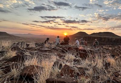 Mountain camp with open game drive vehicles