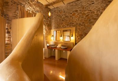 En-suite bathroom with hot tub and rain shower