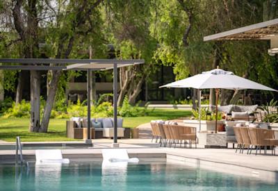 Swimming pool with sun loungers