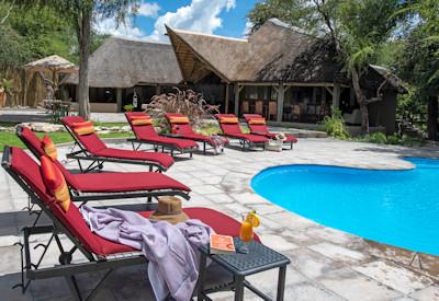 Swimming pool near the game drive vehicles