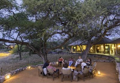 Sunset drinks and fire pit overlooking watering hole