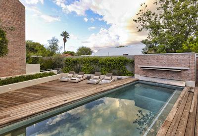 Swimming pool with deck and sun loungers