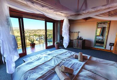 Double bed and stunning views of the Windhoek bushveld