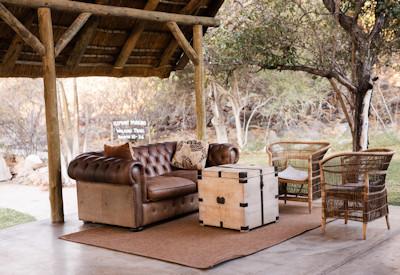 Outdoor lounge with white seringa trees