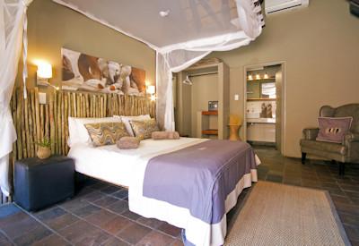 En-suite safari suites with thatched roofs