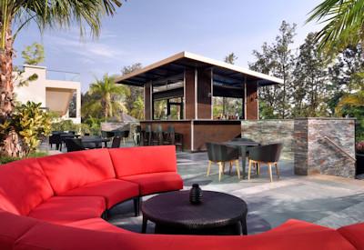 Outdoor lounge area next to pool