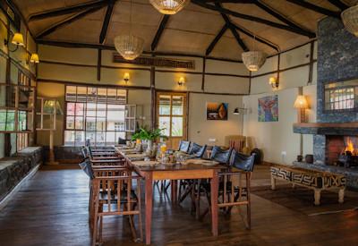 Indoor dining area with large fireplace