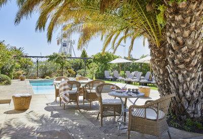 Swimming pool with sun loungers