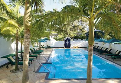 Outdoor swimming pool with sun loungers