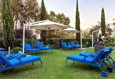 Swimming pool with sun loungers