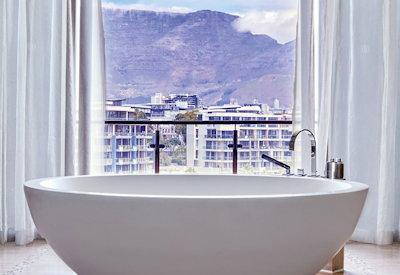 En-suite bathrooms with bath and rain shower
