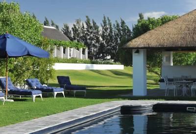 Manicured lawns and a eco pool at the country house