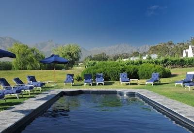 Swimming pool with sun loungers