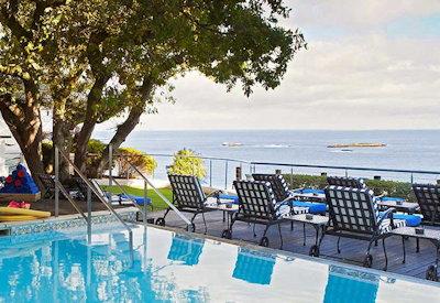 Outdoor pool with sun loungers