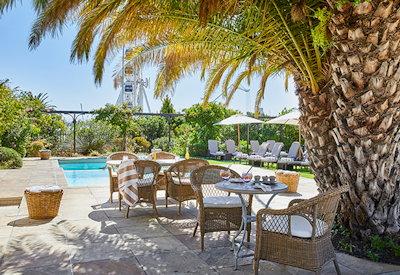 Swimming pool and sun loungers