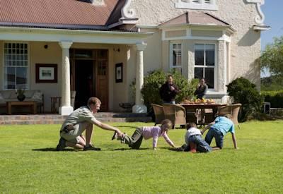 Manicured lawans and large swimming pool