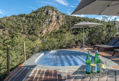 Swimming pool with sun loungers