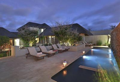 Swimming pool with sun loungers