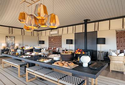 Dining at a large harvest table
