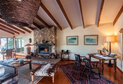 Lounge area with fireplace and writing desk