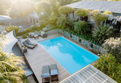 Swimming pool and sun loungers