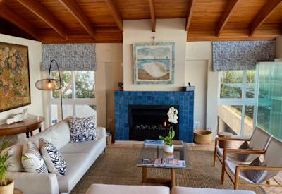 Indoor lounge area with fireplace and views