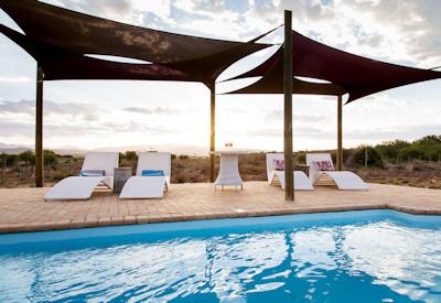 Swimming pool and sun loungers