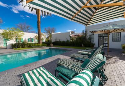 Swimming pool and sun loungers