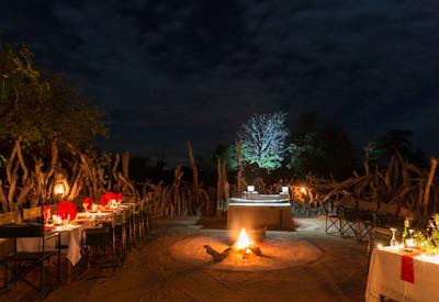 The boma area at night with fireplace