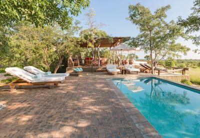 Swimming pool overlooks waterhole at the lodge
