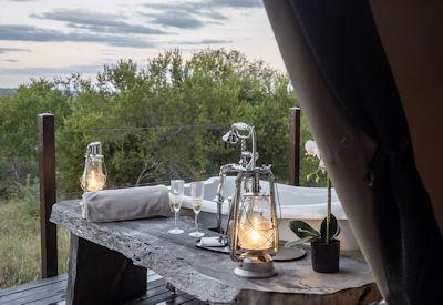 En-suite bathroom with bath tub and indoor and outdoor showers