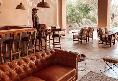 Bar and lounge area with soft leather couches